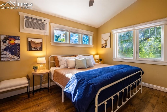 1607 W Pikes Peak Ave, Colorado Springs, CO 80904 - bedroom featuring hardwood / wood-style flooring, multiple windows, vaulted ceiling, a wall mounted AC, and ceiling fan