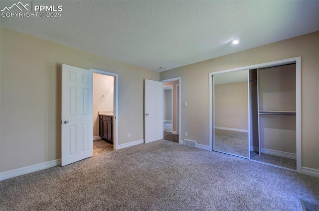 2928 Nevermind Ln, Colorado Springs, CO 80917 - unfurnished bedroom with carpet floors, a textured ceiling, a closet, and recessed lighting