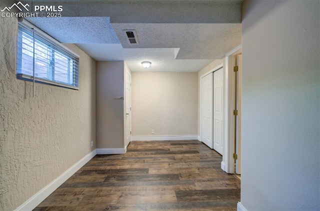 2928 Nevermind Ln, Colorado Springs, CO 80917 - hall with wood finished floors, a textured wall, and a textured ceiling