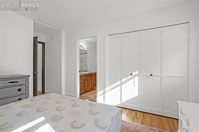 55 Woodbridge Dr, Colorado Springs, CO 80906 - bedroom with light wood-style flooring, a closet, attic access, and ensuite bathroom
