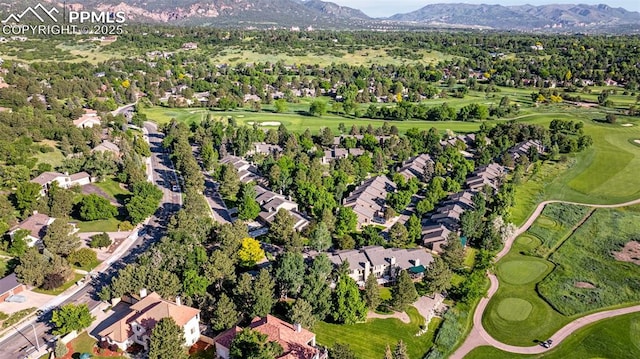 55 Woodbridge Dr, Colorado Springs, CO 80906 - aerial overview of property's location with a mountainous background, a local golf course, and nearby suburban area