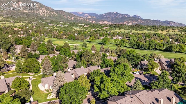 55 Woodbridge Dr, Colorado Springs, CO 80906 - aerial perspective of suburban area featuring a mountainous background and a golf course