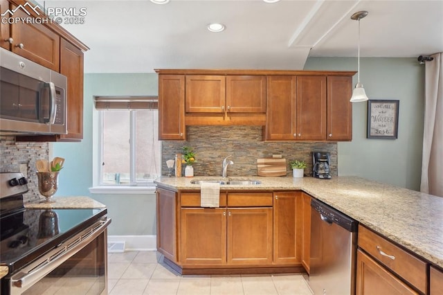 2144 Glenn St, Colorado Springs, CO 80904 - kitchen featuring appliances with stainless steel finishes, a sink, light tile patterned floors, decorative backsplash, and recessed lighting
