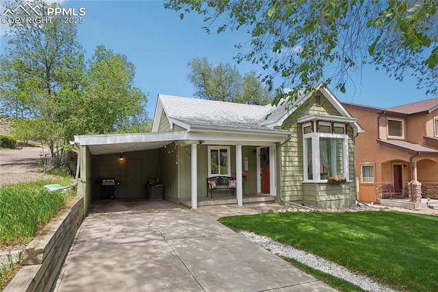 2144 Glenn St, Colorado Springs, CO 80904 - view of front of house with driveway, a front lawn, and a carport