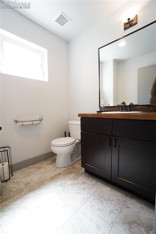 1407 Manitou Blvd, Colorado Springs, CO 80904 - bathroom featuring toilet and vanity