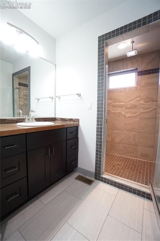 1407 Manitou Blvd, Colorado Springs, CO 80904 - bathroom featuring a shower stall and vanity