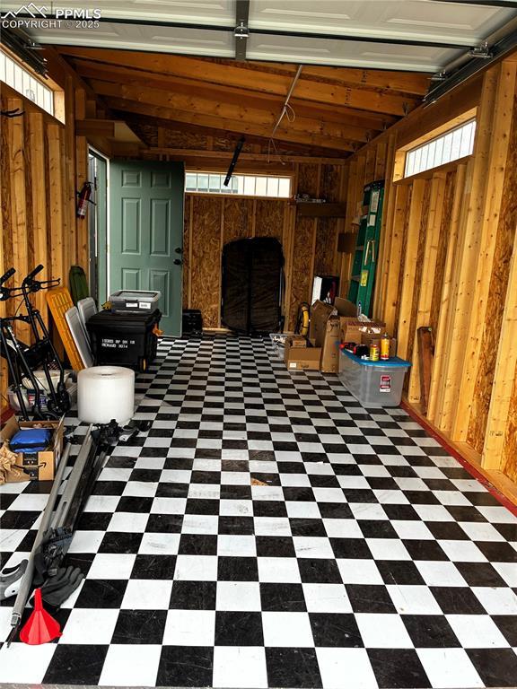 1407 Manitou Blvd, Colorado Springs, CO 80904 - garage featuring wooden walls