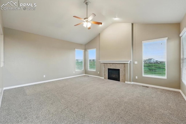 13080 Mt Harvard Dr, Peyton, CO 80831 - unfurnished living room with a ceiling fan, a fireplace, carpet, and high vaulted ceiling