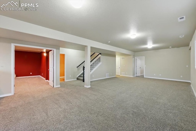 13080 Mt Harvard Dr, Peyton, CO 80831 - finished basement featuring carpet, stairs, and a textured ceiling