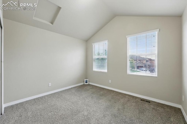 13080 Mt Harvard Dr, Peyton, CO 80831 - empty room featuring carpet flooring, vaulted ceiling, and attic access