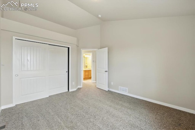 13080 Mt Harvard Dr, Peyton, CO 80831 - unfurnished bedroom featuring carpet, lofted ceiling, and a closet
