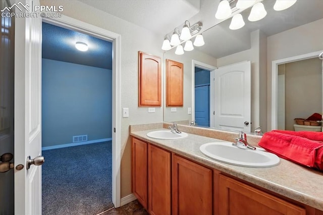13080 Mt Harvard Dr, Peyton, CO 80831 - bathroom with double vanity and baseboards
