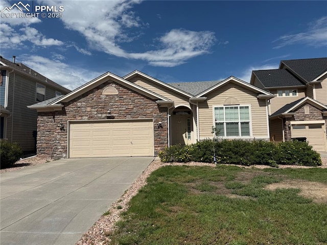 9403 St George Rd, Peyton, CO 80831 - view of front of house featuring driveway, an attached garage, stone siding, and a front yard