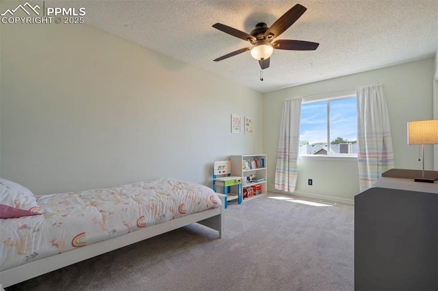 2852 Front Royal Dr, Colorado Springs, CO 80919 - bedroom with a textured ceiling, carpet, and a ceiling fan