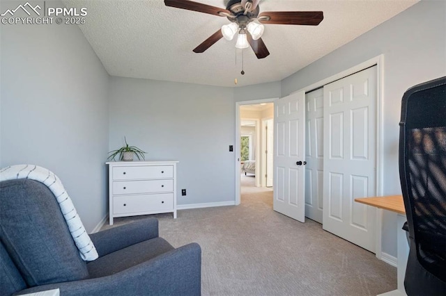 2852 Front Royal Dr, Colorado Springs, CO 80919 - living area featuring carpet floors, a ceiling fan, and a textured ceiling