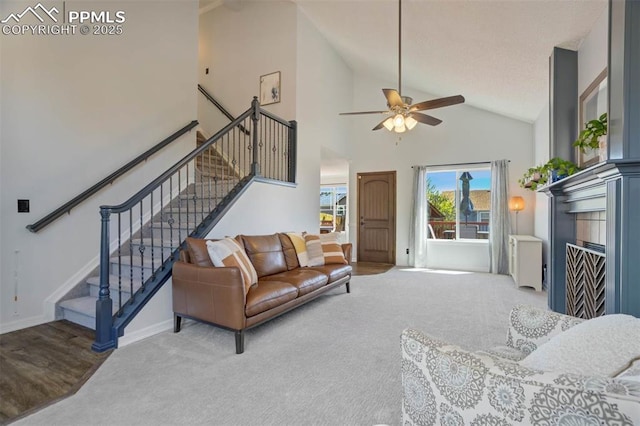 2852 Front Royal Dr, Colorado Springs, CO 80919 - living room with a ceiling fan, stairway, carpet, and high vaulted ceiling
