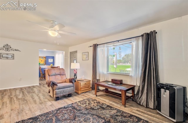 434 Valley Hi Cir Unit D3, Colorado Springs, CO 80910 - sitting room with light wood-style floors and a ceiling fan