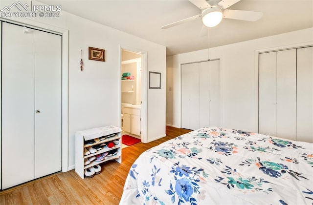 434 Valley Hi Cir Unit D3, Colorado Springs, CO 80910 - bedroom featuring multiple closets, wood finished floors, and a ceiling fan