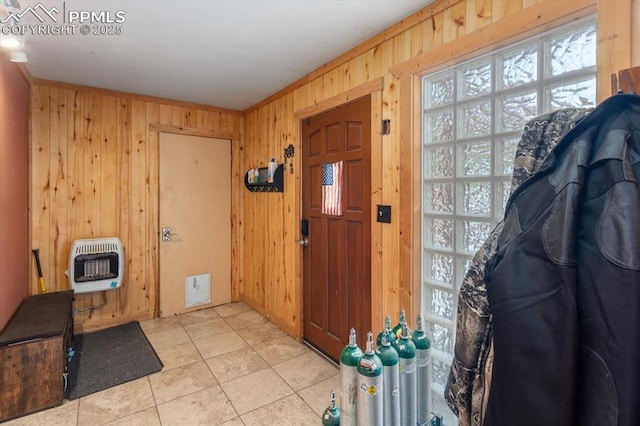 125 1st St, Saguache, CO 81149 - entryway with heating unit, wooden walls, and light tile patterned floors