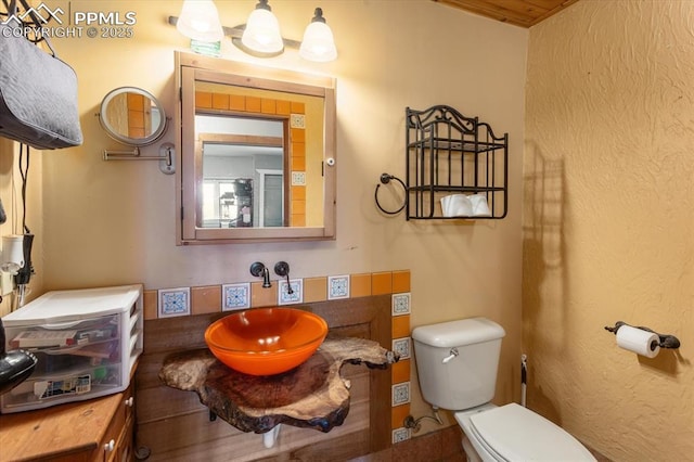 125 1st St, Saguache, CO 81149 - half bathroom with toilet and a sink