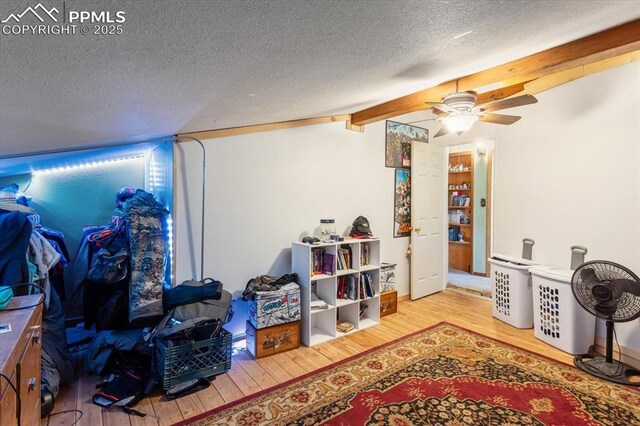 125 1st St, Saguache, CO 81149 - basement with wood finished floors, a textured ceiling, and ceiling fan