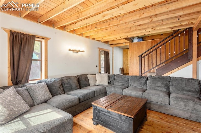 125 1st St, Saguache, CO 81149 - living area featuring hardwood / wood-style flooring, a wooden ceiling with exposed beams, and stairway