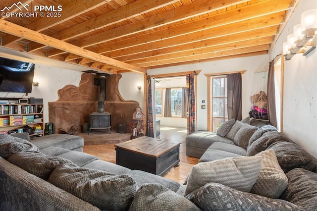 125 1st St, Saguache, CO 81149 - living area with a wood stove and light wood-type flooring