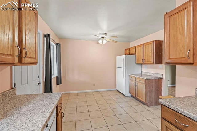 110 Fordham St, Colorado Springs, CO 80911 - kitchen with freestanding refrigerator, ceiling fan, light countertops, and brown cabinetry