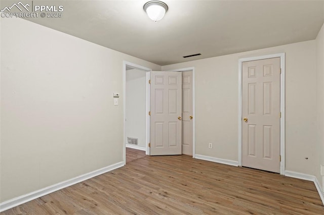 110 Fordham St, Colorado Springs, CO 80911 - unfurnished bedroom with wood finished floors and baseboards