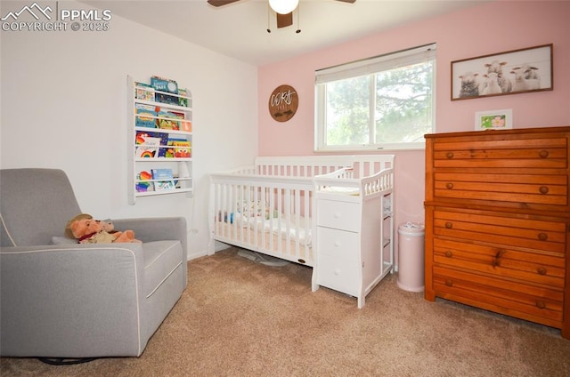 4075 Undimmed Cir, Colorado Springs, CO 80917 - carpeted bedroom featuring a crib and ceiling fan