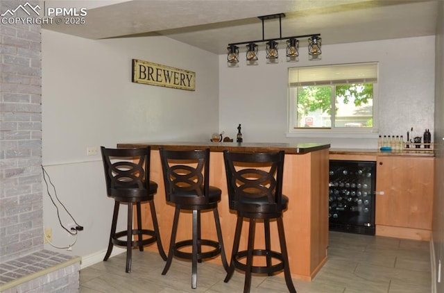 4075 Undimmed Cir, Colorado Springs, CO 80917 - indoor wet bar featuring wine cooler and light tile patterned flooring