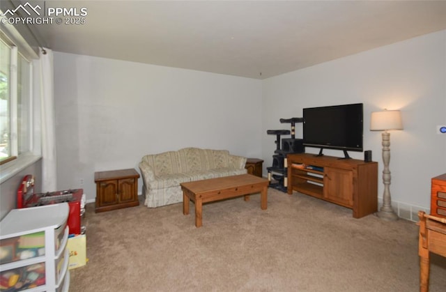 4075 Undimmed Cir, Colorado Springs, CO 80917 - living room with light colored carpet and healthy amount of natural light