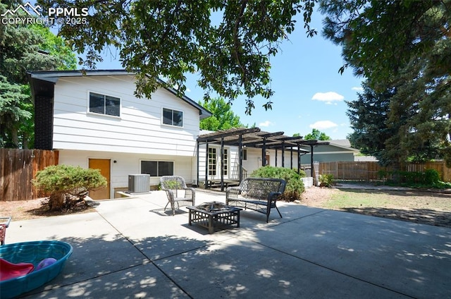 4075 Undimmed Cir, Colorado Springs, CO 80917 - rear view of house with a pergola, a fire pit, and a patio area