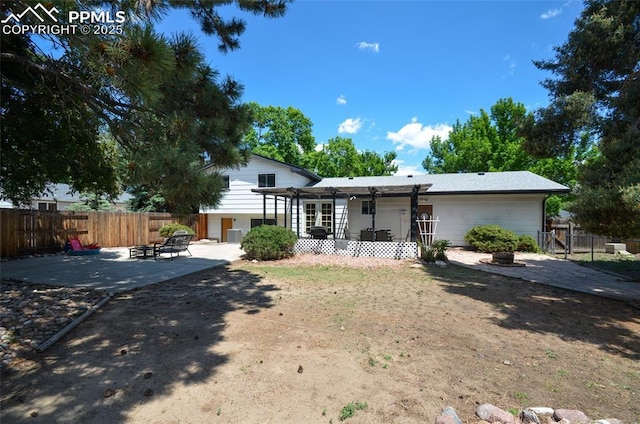 4075 Undimmed Cir, Colorado Springs, CO 80917 - back of property with a fire pit and a patio