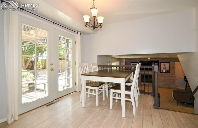 4075 Undimmed Cir, Colorado Springs, CO 80917 - dining area with light wood-style floors and a chandelier