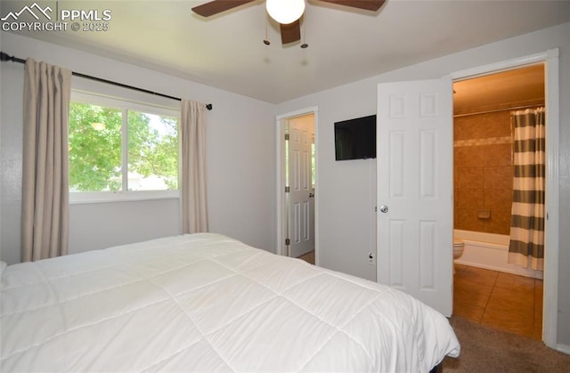 4075 Undimmed Cir, Colorado Springs, CO 80917 - bedroom featuring tile patterned flooring, connected bathroom, and ceiling fan