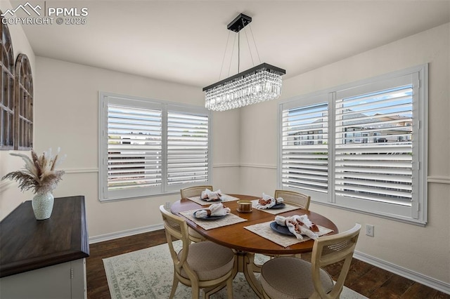 2570 Wimbleton Ct, Colorado Springs, CO 80920 - dining area with dark wood-style flooring, healthy amount of natural light, and a chandelier
