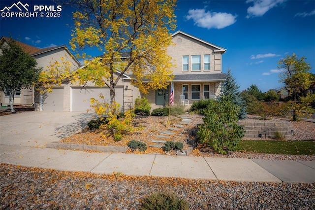 2570 Wimbleton Ct, Colorado Springs, CO 80920 - view of front of home featuring driveway, an attached garage, and brick siding