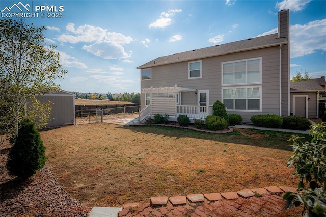 2570 Wimbleton Ct, Colorado Springs, CO 80920 - rear view of house with a pergola, a chimney, and a storage unit