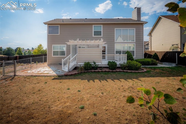 2570 Wimbleton Ct, Colorado Springs, CO 80920 - rear view of house with a pergola, a fenced backyard, a patio area, and a chimney