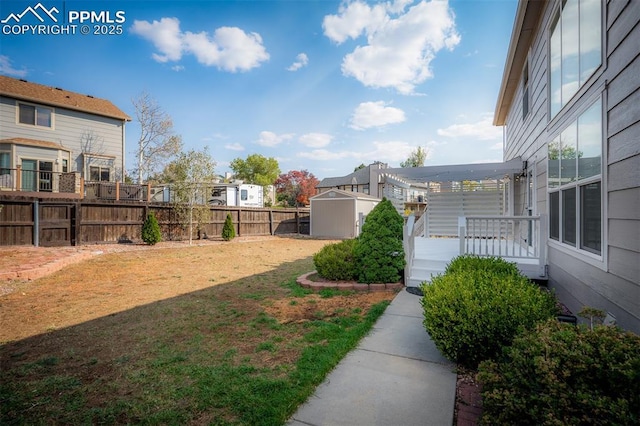 2570 Wimbleton Ct, Colorado Springs, CO 80920 - fenced backyard with a storage shed and a wooden deck