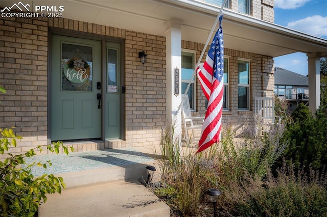 2570 Wimbleton Ct, Colorado Springs, CO 80920 - property entrance with brick siding and covered porch