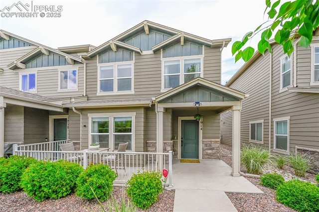 1914 Birmingham Loop, Colorado Springs, CO 80910 - view of front facade featuring board and batten siding and covered porch