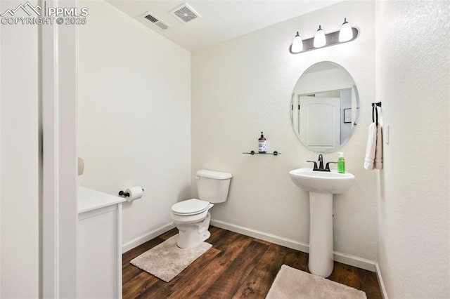 1914 Birmingham Loop, Colorado Springs, CO 80910 - bathroom featuring toilet and wood finished floors