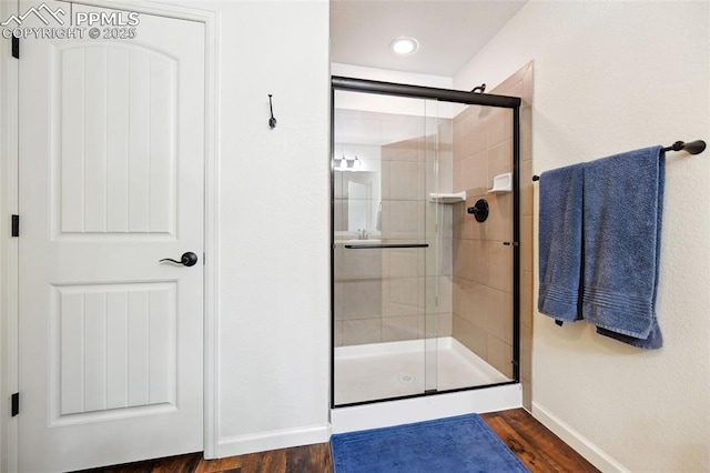 1914 Birmingham Loop, Colorado Springs, CO 80910 - bathroom featuring a shower stall and wood finished floors
