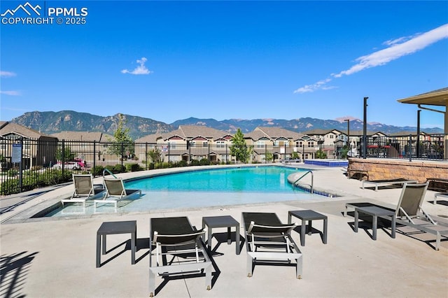 1914 Birmingham Loop, Colorado Springs, CO 80910 - community pool featuring a patio, a mountain view, and a residential view