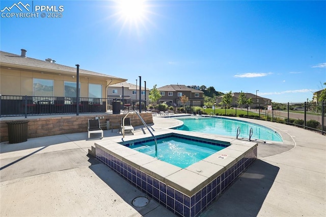 1914 Birmingham Loop, Colorado Springs, CO 80910 - community pool featuring a community hot tub, a patio area, and a residential view