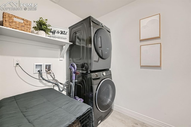 1851 Spring Water Pt, Colorado Springs, CO 80908 - laundry room featuring stacked washer and clothes dryer and baseboards