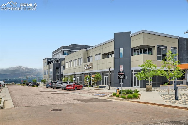1851 Spring Water Pt, Colorado Springs, CO 80908 - view of property featuring a mountain view and uncovered parking