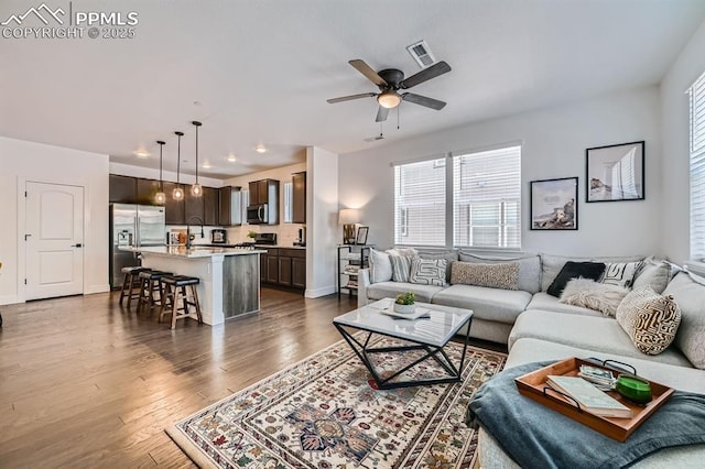 1851 Spring Water Pt, Colorado Springs, CO 80908 - living room featuring dark wood-style floors and ceiling fan